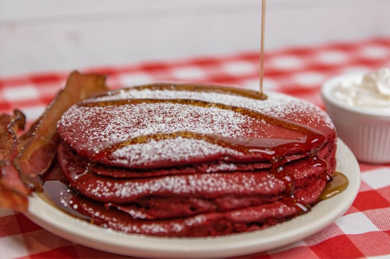 red velvet pancakes with a side of bacon